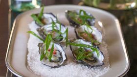 Freshly shucked Sydney rock oysters with lemongrass, chilli and shallot dressing