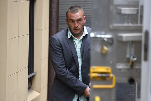 Diego Carbone is led to a prison transfer van at the NSW Supreme Court in Sydney today. (AAP)