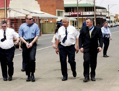 Convicted murderer Robert Joe Wagner (Handcuffed) is appealing a non-parole sentence and the victims are concerned if he ever gets out he will kill again.(AAP Image/Rob Hutchison) 