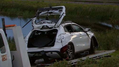 The bodies of the two men were pulled from the car.