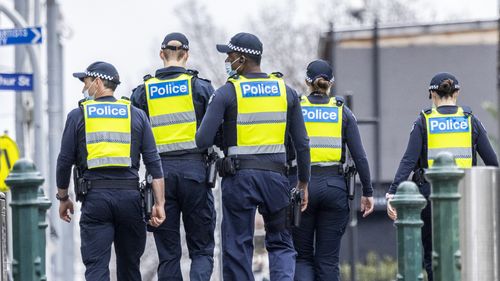 Police patrol Melbourne CBD during lockdown.