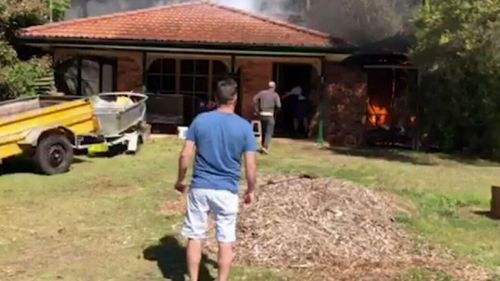 Neighbours help rescue the woman 'in nick of time' in Umina, NSW.