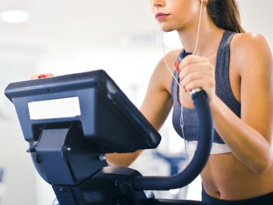 Woman on elliptical at the gym