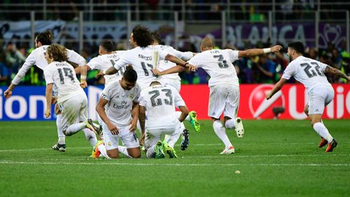 Real Madrid's players celebrate after winning. (AFP)