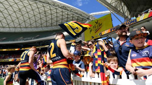 Thousands of Crows fans attended the 9.30am training session at Adelaide Oval. (AAP)