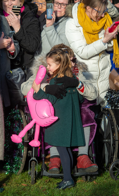 Gemma Clark from Lincolnshire hugs Princess Charlotte after the Christmas Day morning church service at St Mary Magdalene Church in Sandringham, Norfolk. 