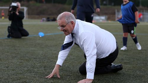 Prime Minister Scott Morrison accidentally knocks over a child during a visit to the Devonport Strikers Soccer Club, which is in the electorate of Braddon in Devonport, Australia. 