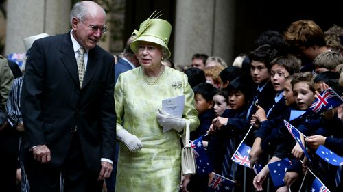 The Queen greets students from St Andrews School on her one day Sydney visit.