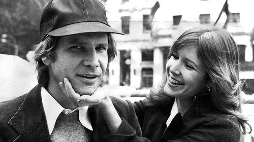 Fisher and Ford pictured in New York together during a promotional tour for Star Wars: A New Hope. (Getty)