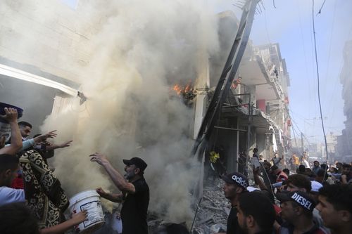 Palestinians look for survivors after an Israeli strike on Rafah, Gaza Strip, Friday, Nov. 17, 2023. 