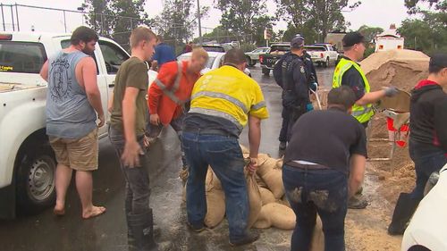 Volunteer and locals sandbagging in Windsor, on the Hawkesbury River.