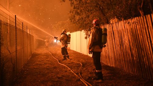 Firefighters were left exhausted as the blaze burned through more than 3200 hectares of land stretching from Wattle Grove to Menai. Picture: 9NEWS.