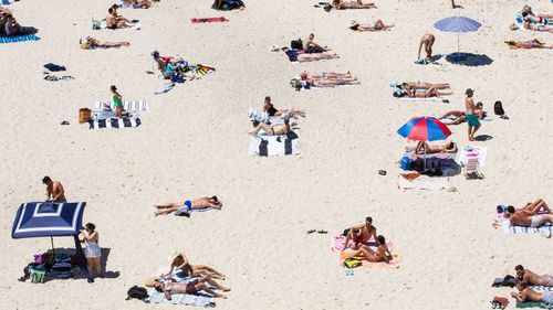 Sydneysiders taking advantage of the warm weather at Tamarama Beach.