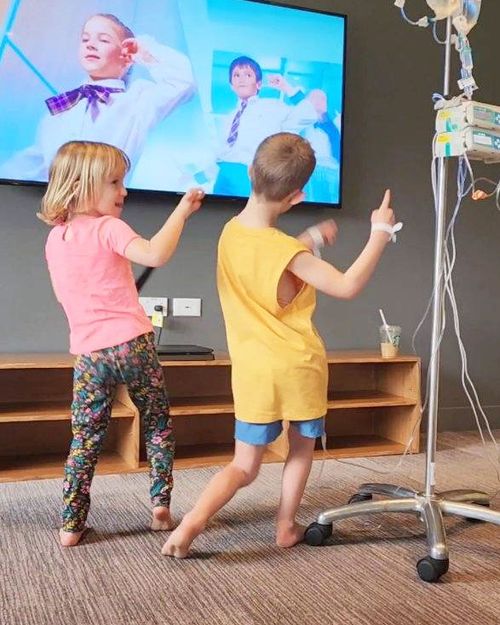 Oliver remained in "high spirits" his mother said. He is pictured here dancing with his sister in hospital. 