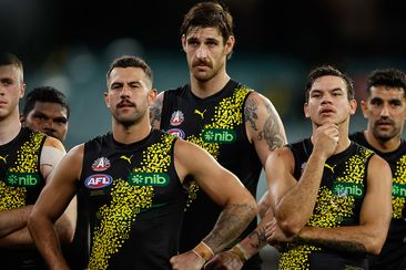 Jack Graham, Sam Naismith and Daniel Rioli of the Tigers look on during the 2024 AFL Round 07 match between the Richmond Tigers and the Melbourne Demons at the Melbourne Cricket Ground on April 24, 2024 in Melbourne, Australia. (Photo by Dylan Burns/AFL Photos via Getty Images)