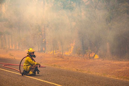 Crews continue to monitor containment lines as cyclonic winds and scorching temperatures keep causing problems.