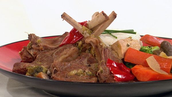 Braised lamb cutlets with vegetables on a timbale of rice