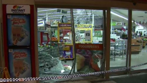 Security guard hospitalised after vehicle smashes into Woodridge store front