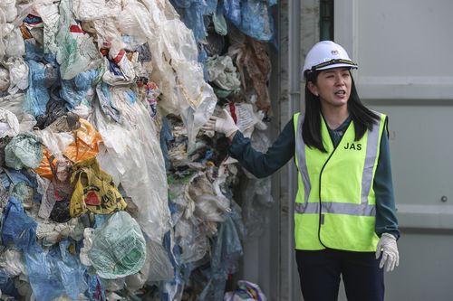 Malaysia's Minister of Energy, Science, Technology, Environment and Climate Change, Yeo Bee Yin shows plastic waste inside a cargo container before it is sent back to the country of origin in Port Klang, Selangor, Malaysia, 28 May 2019. 