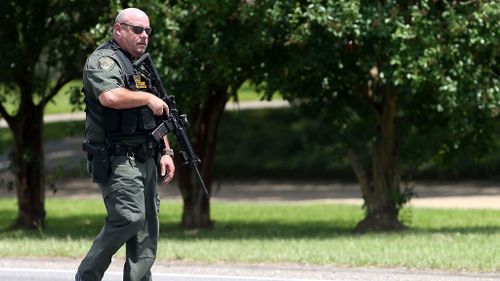 Baton Rouge Police officers patrol Airline Hwy (Getty)
