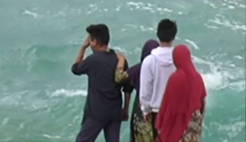 Mr Yari's family watched the search from the shoreline, with his father vowing to stay "until I get my missing son" 

