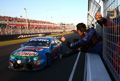 Moztert salutes his team as he takes the chequered flag. (AAP)