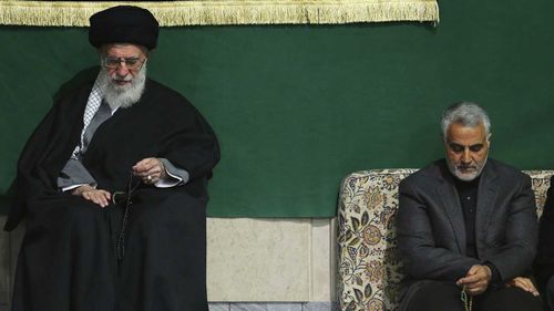 The commander of Iran's Quds Force, Qassem Soleimani, right, sits next to the Supreme Leader Ayatollah Ali Khamenei.