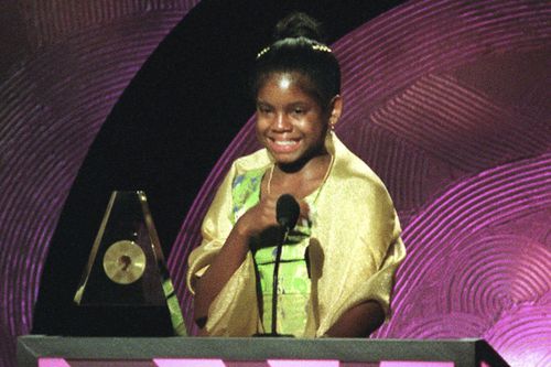 ILE - Hydeia L. Broadbent, 14, speaks after receiving an Essence Award during the taping of the 1999 Essence Awards in New York on Friday, April 30, 1999. Broadbent, who was born with HIV and has been living with full-blown AIDS since age 5, has become a powerful spokesperson and AIDS activist. Broadbent, a prominent HIV/AIDS activist known for her inspirational talks in the 1990s as a young child to reduce the stigma surrounding the virus she was born with, has died. She was 39. (AP Photo/Stua