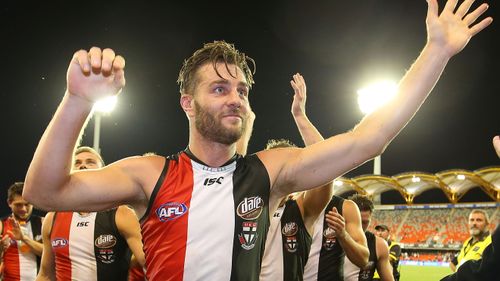 Sam Fisher celebrates after winning his 200th game for St Kilda.