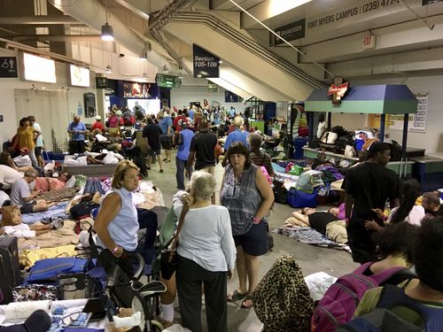 Evacuees fill Germain Arena, which is being used as a fallout shelter, in advance of Hurricane Irma, in Estero, Florida (AAP)