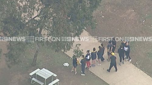 Year 7 students were reportedly on the oval when there was a lightning strike nearby. (9NEWS)