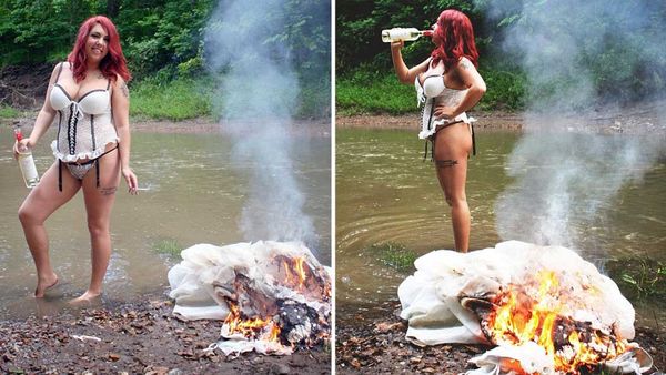 Katlynn McKee drinks wine from the bottle as her wedding dress goes up in flames. (Caters News Agency)