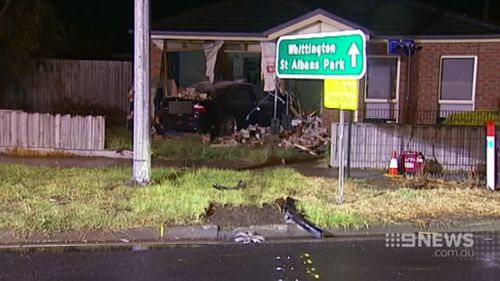 The car smashed through a fence before hitting the house. (9NEWS)