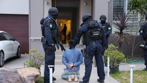 Police stormed more than 20 properties across Sydney and in the ACT, making numerous arrests. (NSW Police)