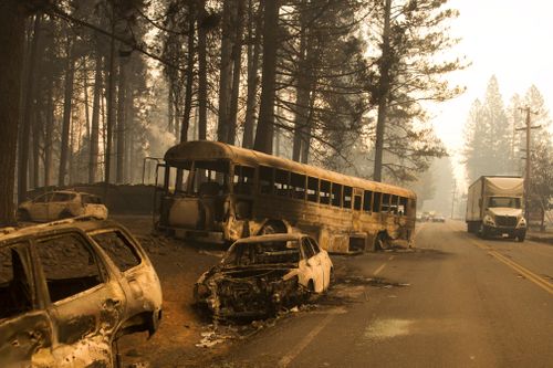 Abandoned cars from fleeing residents of the Magalia and Paradise Pine area line Skyway Road.