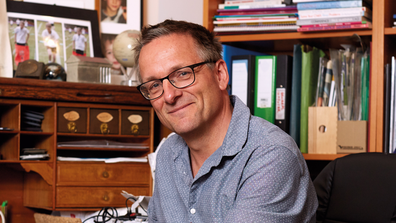 Dr Michael Mosley sitting in an office