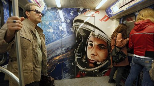 A train on the Moscow Metro is painted to pay tribute to Yuri Gagarin.