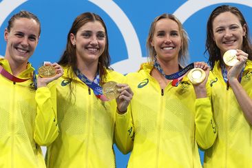 From left: Bronte Campbell, Meg Harris, Emma McKeon and Cate Campbell celebrate winning gold in the women&#x27;s 4x100m freestyle relay at the Tokyo 2021 Olympics.