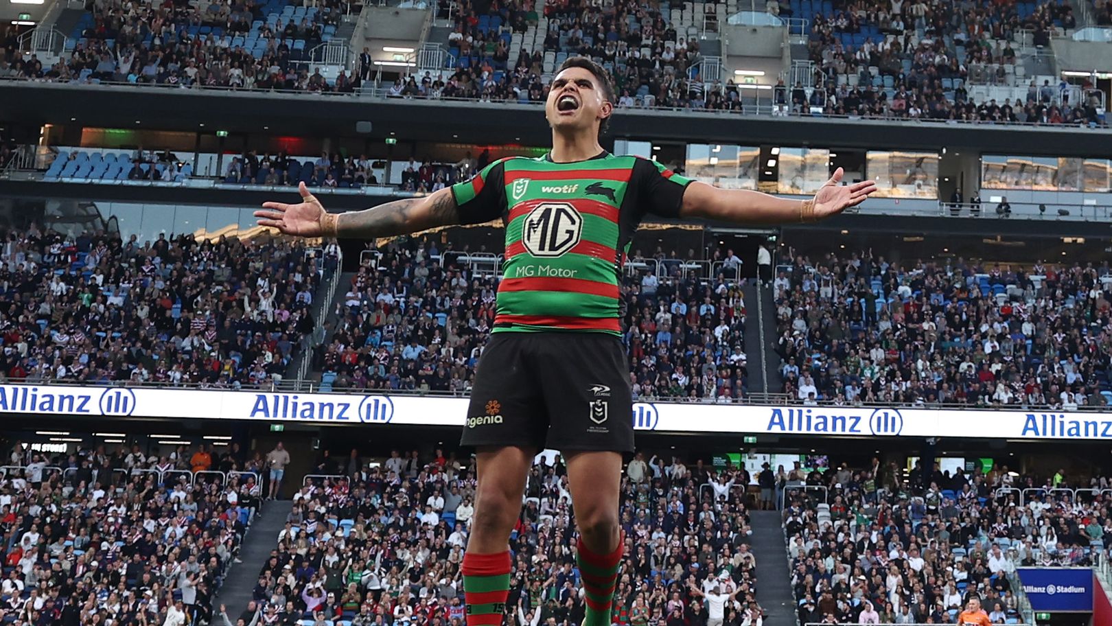 Latrell Mitchell fires up the Allianz Stadium crowd after kicking a conversion against the Roosters.
