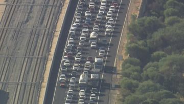 There has been commuter chaos on Kwinana Freeway after a motorbike and truck collided near Jandakot.