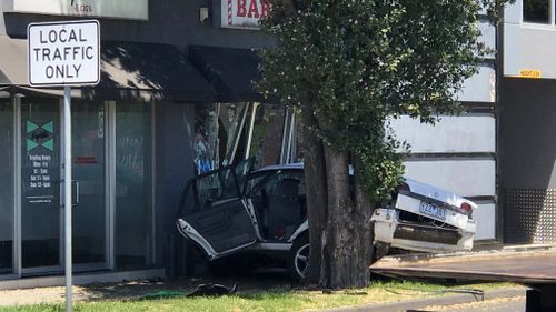 The offending vehicle smashed into the barber shop in Altona North this afternoon.