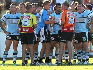 Sharks players gather after a Bulldogs try. (Getty)