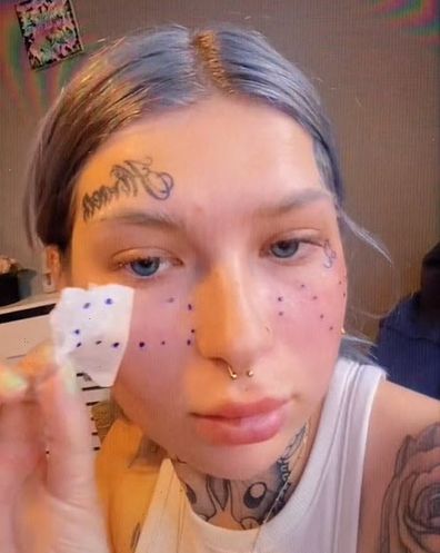 Woman face tattoos freckles