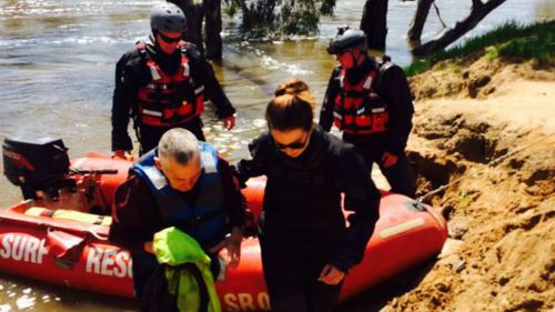 The man and his dog were eventually rescued from a tree near the Yarrawonga Holiday Park. (9NEWS)