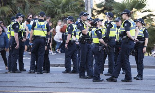 A group of police in St Kilda Road ahead of the New Year's Eve celebrations in Melbourne yesterday. (AAP)