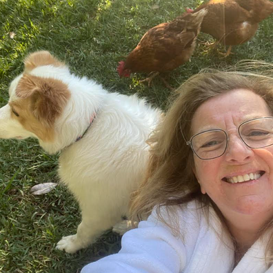 Jean Kittson with her dog and chickens
