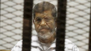 Former Egyptian President Mohamed Morsi in court in 2014. (AAP)