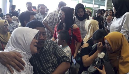 Relatives of the passengers aboard the Lion Air flight JT610, gather at Pangkal Pinang airport.
