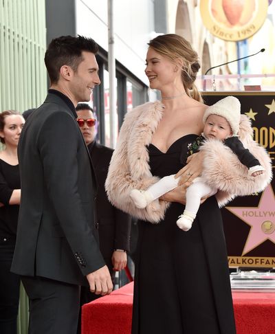<p>Model Behati Prinsloo and musician Adam Levine, welcomed daughter&nbsp;Dusty Rose Levine in September last year. They are pictured here at the ceremony to honour Adam's star on the Hollywood Walk of Fame in February.</p>