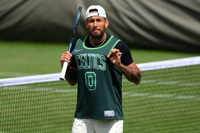 Nick Kyrgios of Australia is seen practising in a Boston Celtics Basketball Jersey on day eleven of The Championships Wimbledon 2022 at All England Lawn Tennis and Croquet Club.